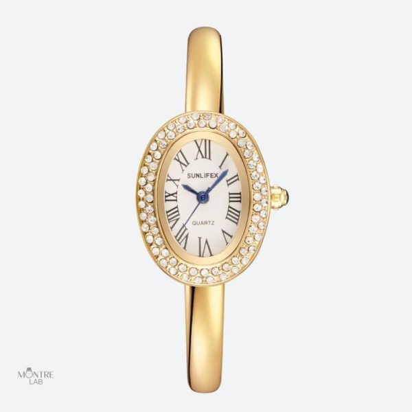 montre-femme-ovale-dorree-strass-cadran-chiffres-romains-quartz-1 Montre femme ovale dorée avec strass et cadran chiffres romains