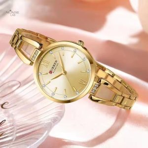 Montre élégante pour femme en métal doré