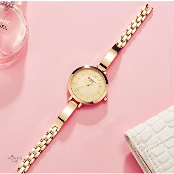 Montre quartz femme avec un cadran rond et minimaliste