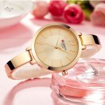 Élégante montre femme, style minimaliste en version ronde